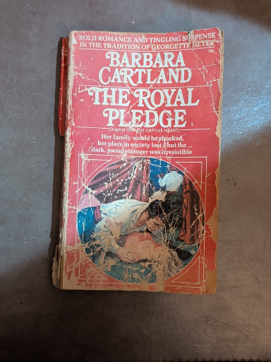Paperback romance novel titled 'The Royal Pledge' by Barbara Cartland