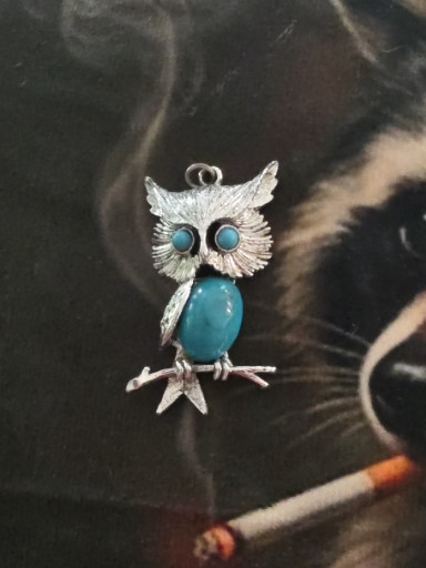Silver-tone owl pendant with faux turquoise cabochon body and eyes