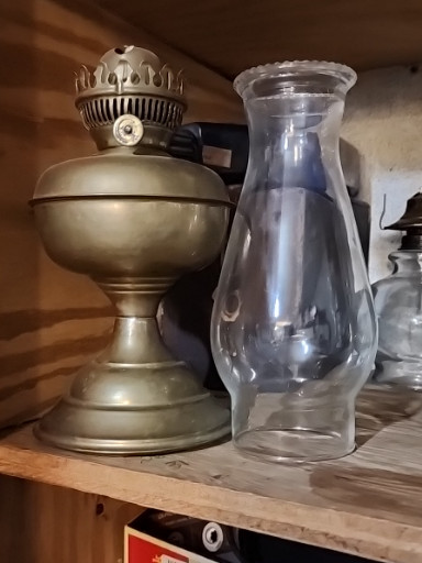 Vintage brass kerosene oil lamp with glass chimney