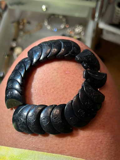 Carved black stone or resin bracelet with Chinese figure motifs