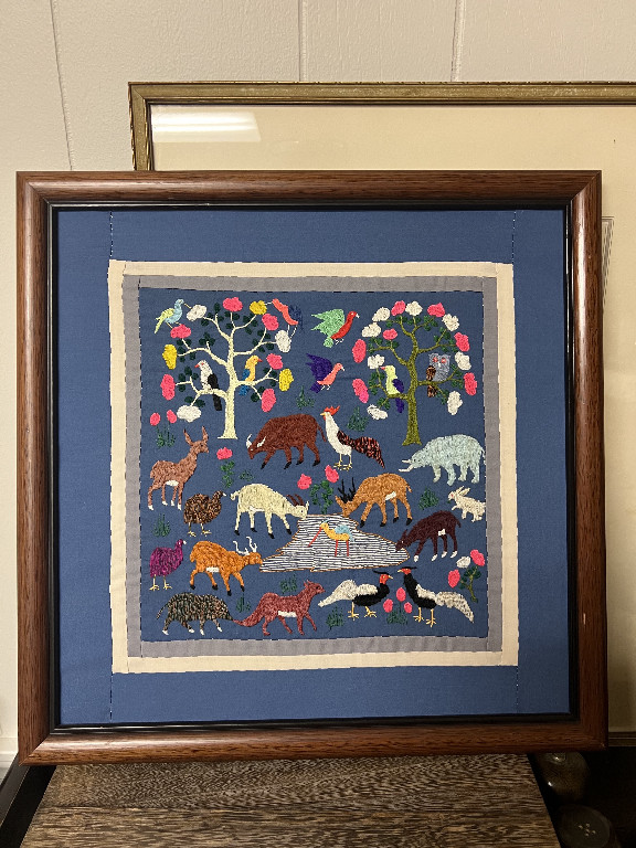 Textile art story cloth depicting animals and trees, Hmong embroidery