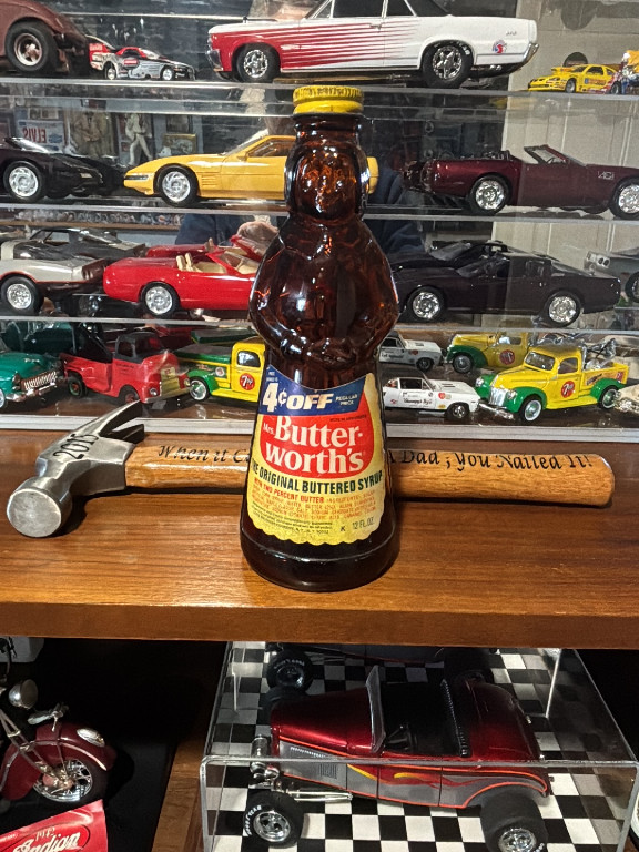 Glass syrup bottle shaped as 'Mrs. Butterworth's' by Lever Brothers Company, 12 oz size