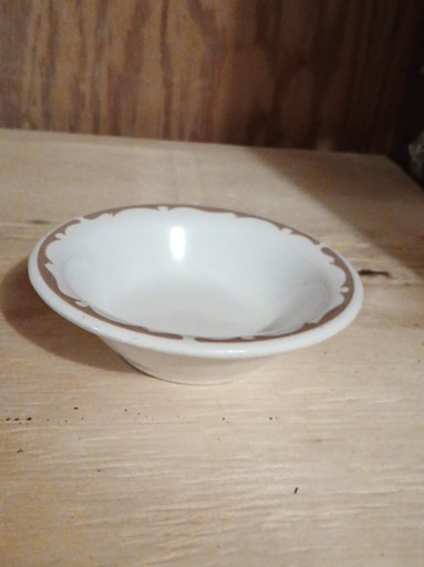 Ceramic dessert bowl by Buffalo China with brown stencil edge pattern. We have two of these available.