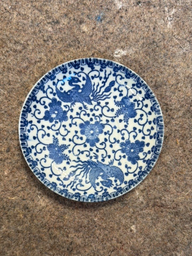 Porcelain plate with blue and white phoenix and floral motif by Tashiro Shoten