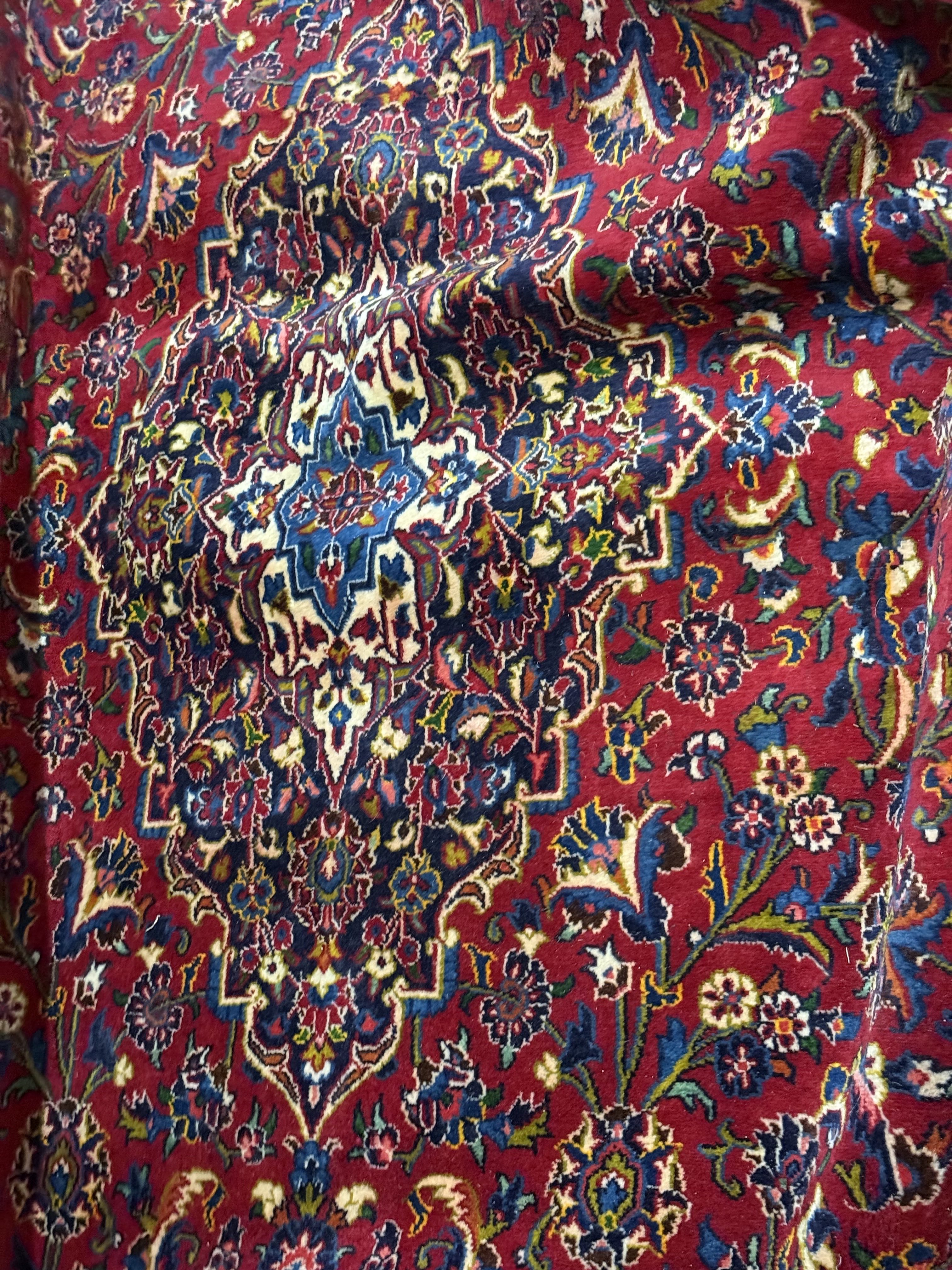 Wool Persian rug with floral medallion design