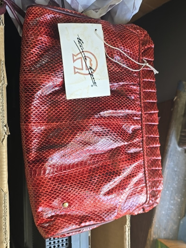 Red snakeskin-embossed leather handbag with shoulder strap