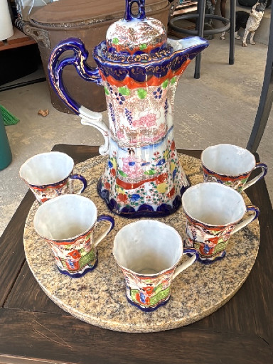Hand-painted porcelain chocolate pot set with five cups, featuring Geisha Girl motif with cobalt blue and gold trim