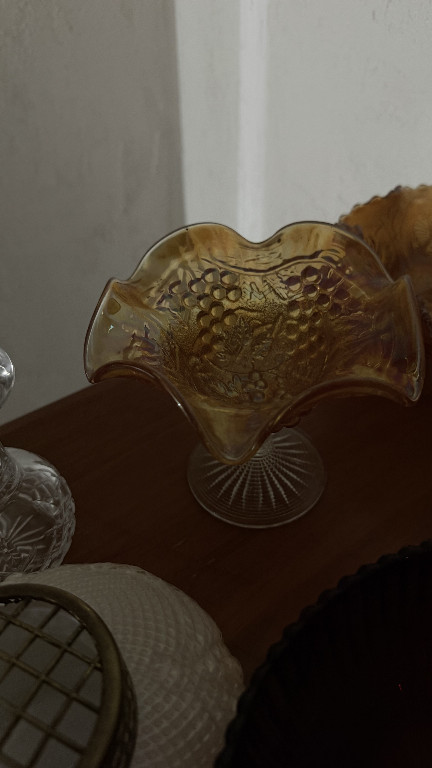 Marigold carnival glass compote with grape and leaf pattern