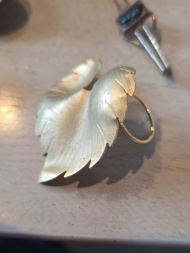 Reproduction of silver-tone metal leaf brooch, likely inspired by Coro designs