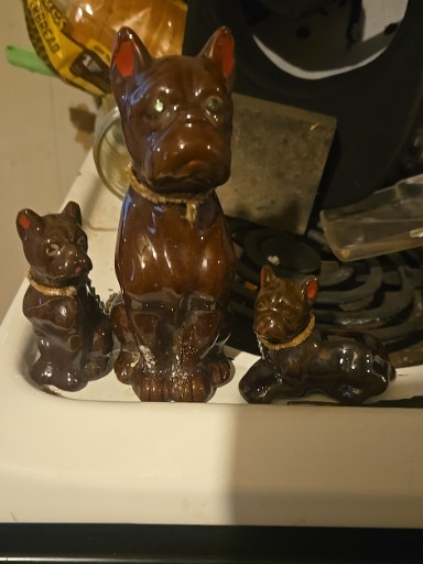 Glazed ceramic boxer dog figurine set