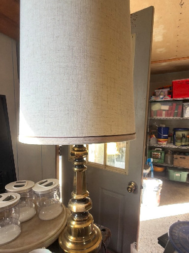 Brass table lamp with stacked ball base and fabric drum shade