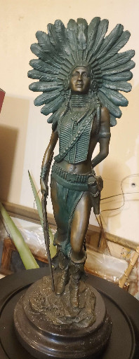 Bronze sculpture titled 'Native American Female Warrior with Feathered War Bonnet'