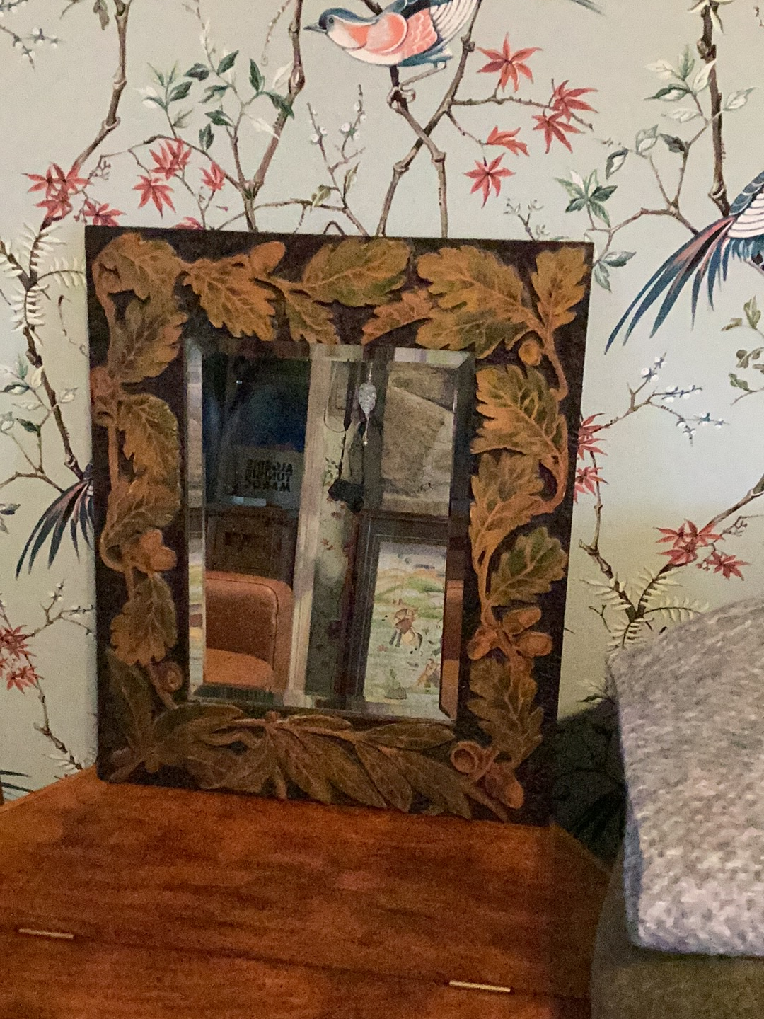 Carved wooden mirror with oak leaf motif frame
