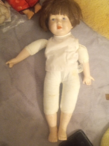 Porcelain doll with cloth body by Russ Berrie