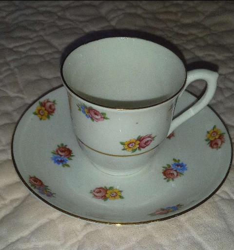 Bone china teacup and saucer with floral decoration by Colclough
