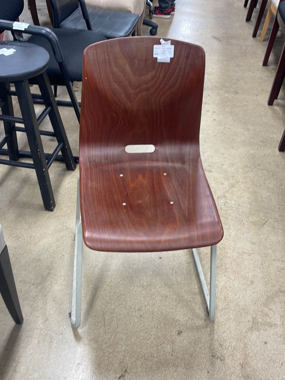 Pagholz molded plywood chair by Galvanitas
 vintage molded plywood stacking chair, most likely manufactured by Pagholz Flötotto in West Germany during the 1960s or 70s. These chairs were widely used in schools and institutional settings because of their extreme durability and stackable design