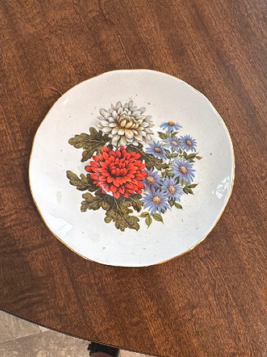 Bone china decorative plate with floral design featuring chrysanthemums and daisies