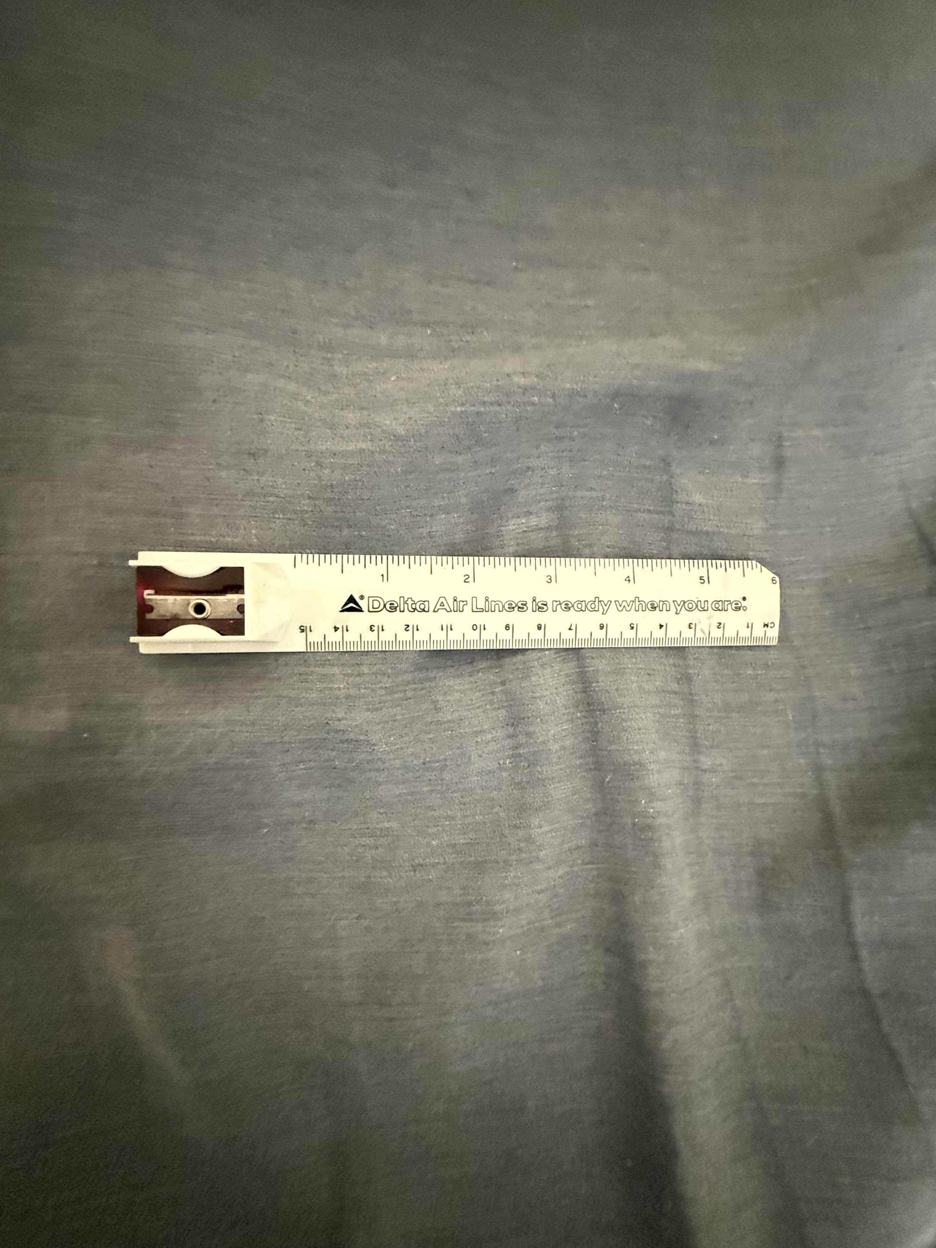 Plastic promotional ruler with pencil sharpener by Delta Air Lines