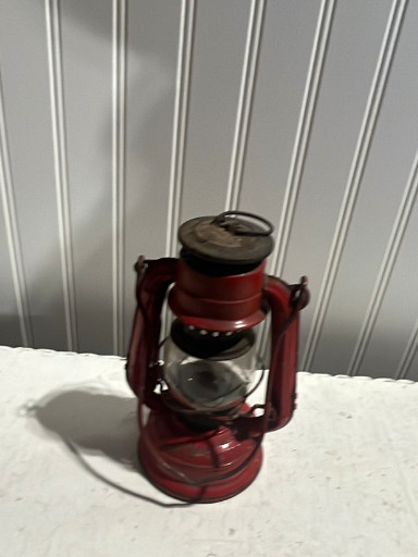 Red painted metal kerosene lantern, 'Winged Wheel No. 350', made in Japan