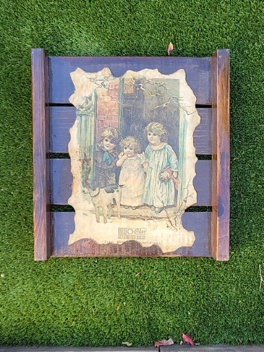 Vintage wooden advertising display titled 'The First Snow Fall' by O-Cedar Polish