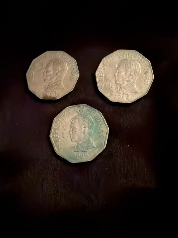 Three Philippine 2 Piso coins featuring Andres Bonifacio, issued by Bangko Sentral ng Pilipinas
