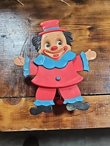 Plastic clown wall decoration or light switch cover, likely manufactured by Carnival by Grove