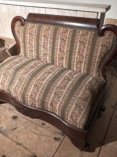 Mahogany settee with carved swan arms in Empire or Victorian style