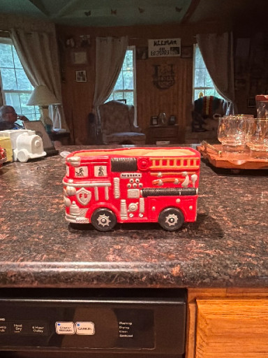 Vintage red plastic fire truck planter or piggy bank