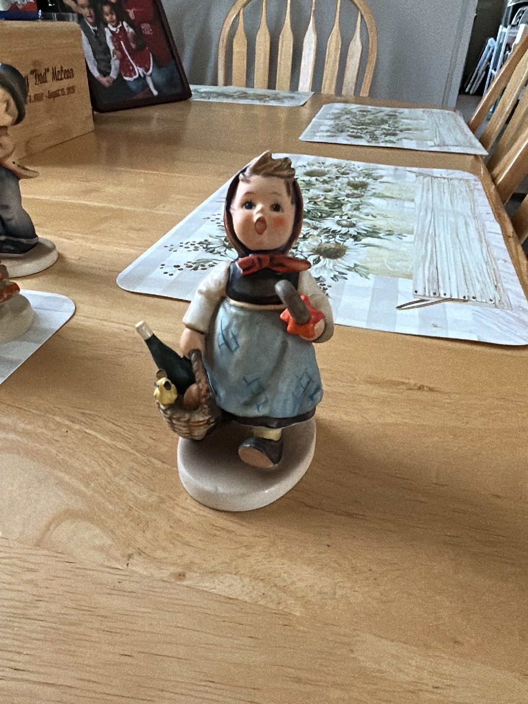 Porcelain figurine titled 'Visiting an Invalid' by Goebel Hummel