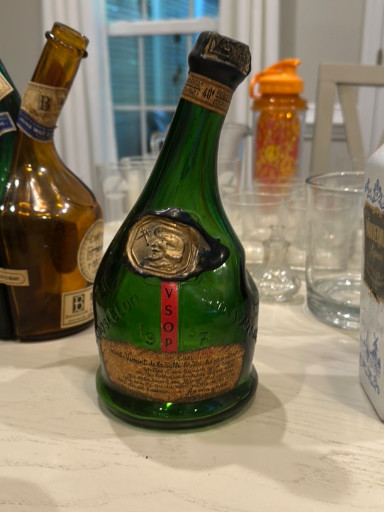 Green glass bottle of Saint-Vivant Armagnac with Exposition Universelle medallion