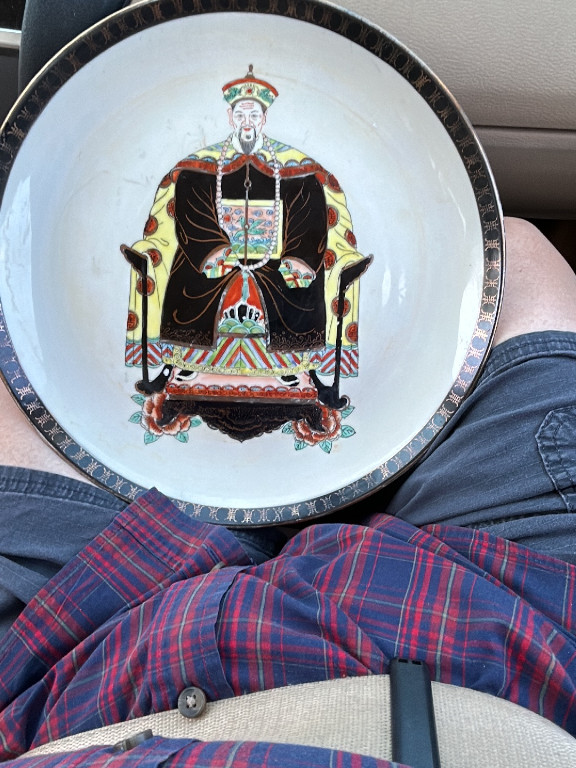 Porcelain plate depicting a Qing Dynasty emperor, marked 'Da Qing Qianlong Nian Zhi', made in Macau