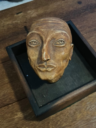 Carved wooden Egyptian-style sarcophagus mask or mummy face panel
