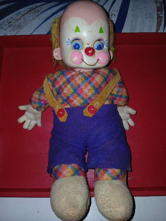 Vintage rubber-head clown doll with fabric body