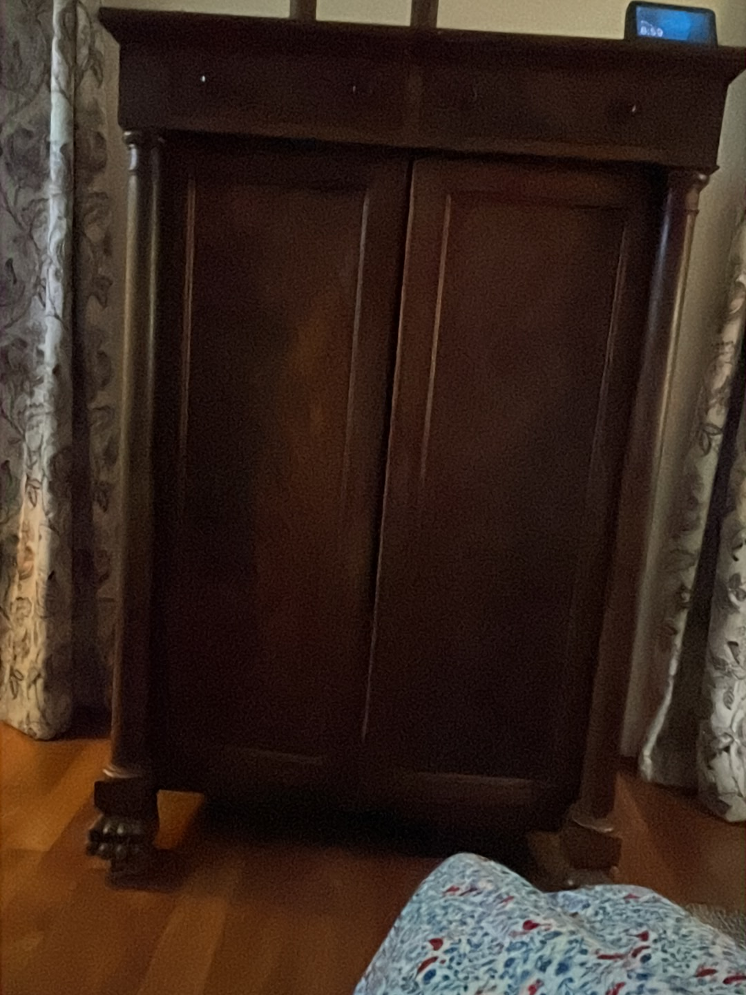 Mahogany Empire style cabinet with column details and claw feet