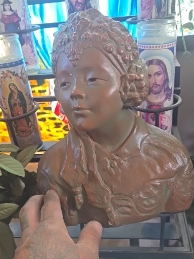 Terracotta bust of a young woman in Victorian style