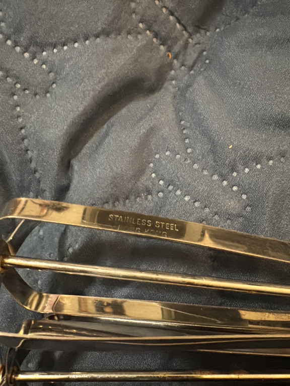 Gold-tone stainless steel tie clip by Swank