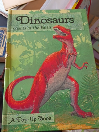 Pop-up book titled 'Dinosaurs: Giants of the Earth' illustrated by Richard Courtney