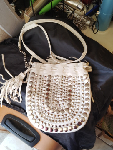 White studded crossbody purse with fringe detail by Candie's