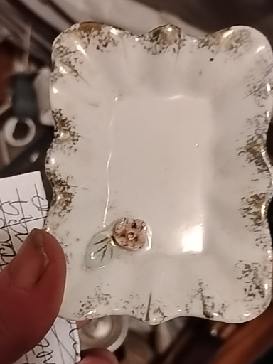 Porcelain trinket tray with gold trim and floral accent