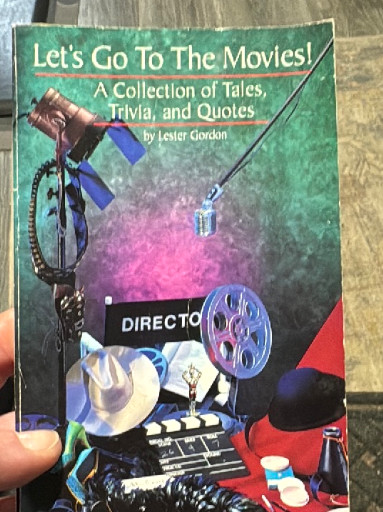 Paperback book titled 'Let's Go To The Movies! A Collection of Tales, Trivia, and Quotes' by Lester Gordon