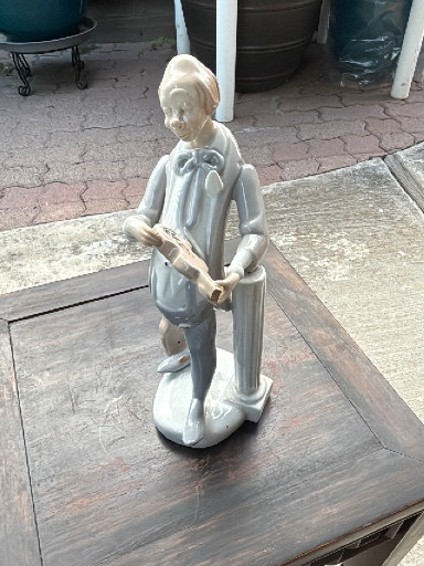 Porcelain figurine of a clown playing violin, made in Spain. 12” tall x 5” wide.