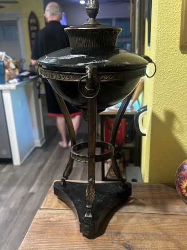 Bronze or brass Empire-style urn oil lamp with tripod base and lion ring handles