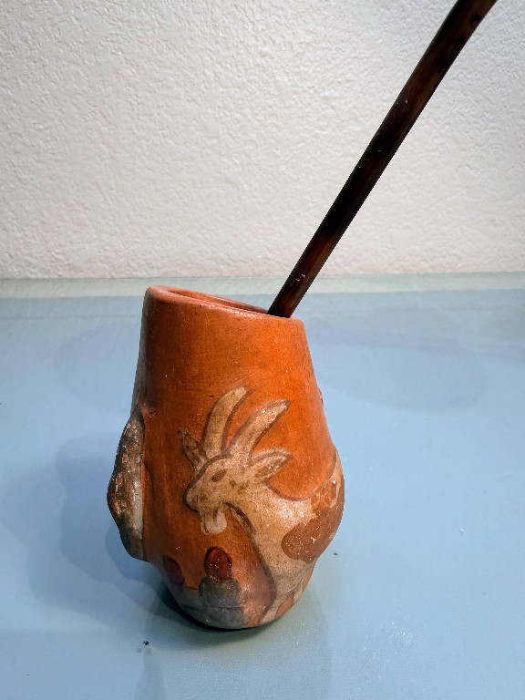 Terracotta yerba mate cup (mate) with deer motif and metal bombilla straw from Argentina