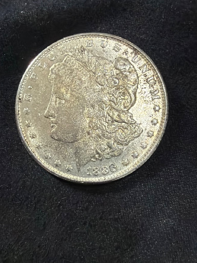 Dólar Morgan de plata de 1886, acuñado por la Casa de la Moneda de los Estados Unidos
