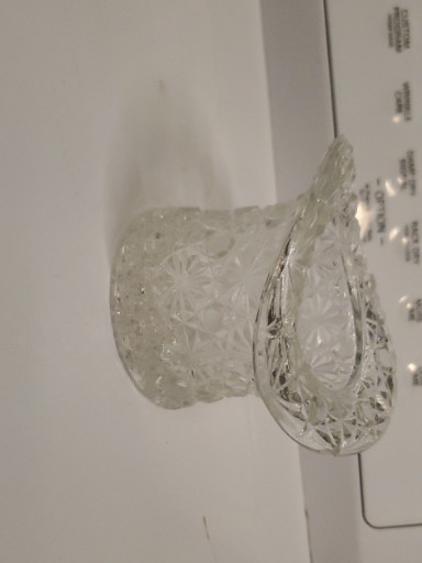 Clear pressed glass top hat vase in 'Daisy and Button' pattern by Fenton