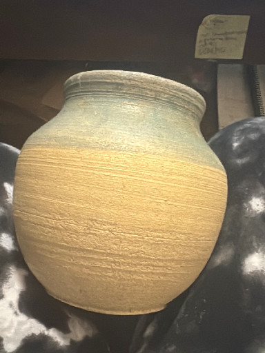 Stoneware pottery vase with horizontal ribbed texture and natural earth-tone glaze