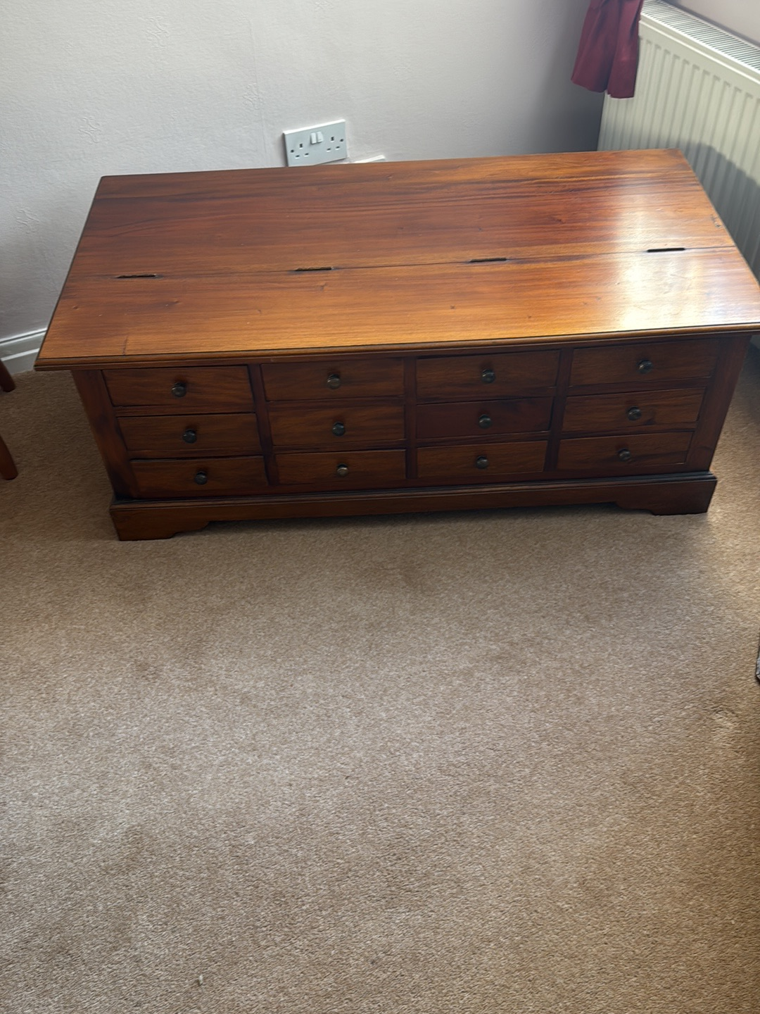 Wooden apothecary-style coffee table with multiple drawers