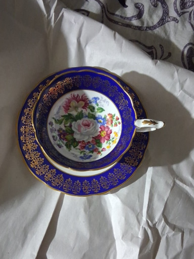 Bone china teacup and saucer set titled 'Empress' by Royal Stafford