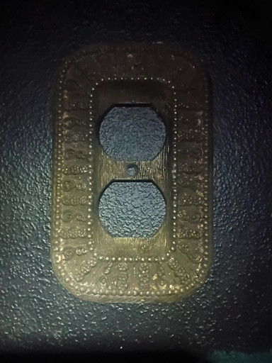 Brass-plated metal electrical outlet cover plate by American Tack & Hardware Co.