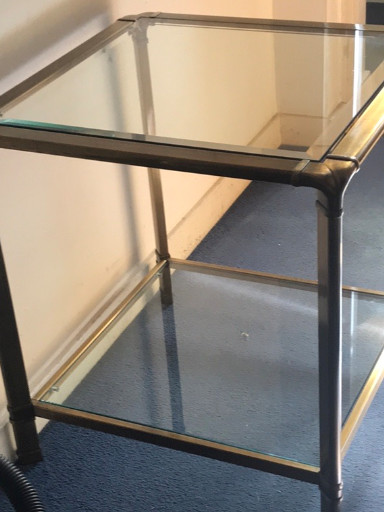 Modern two-tier side table with metal frame and glass shelves